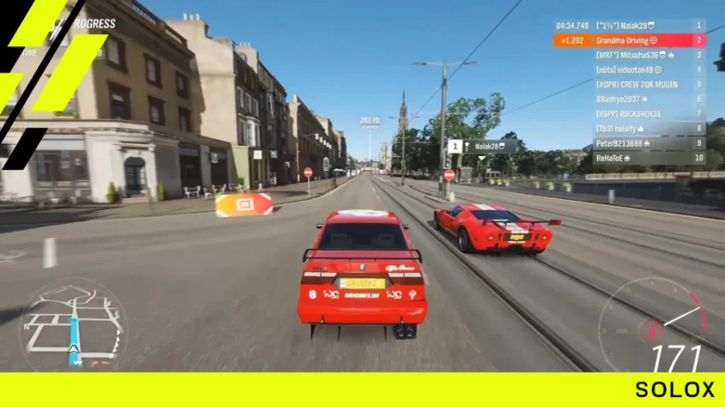 A red Alfa Romeo touring car and a Ford GT racing through the streets of Edinburgh in Forza Horizon 4