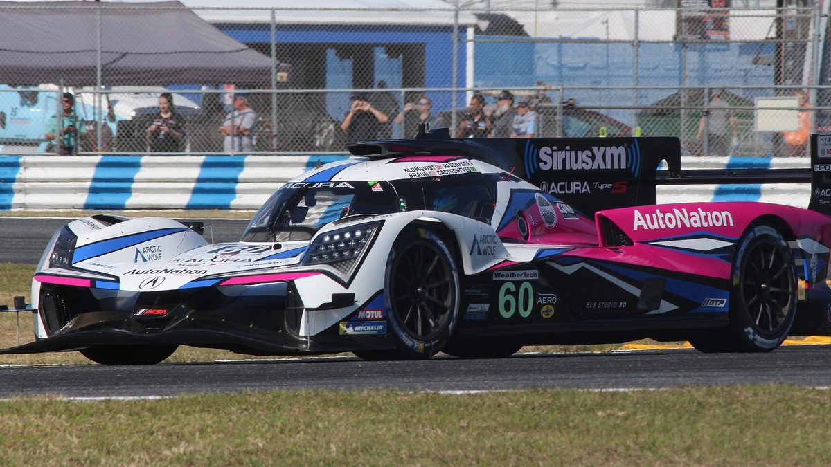 The number 60 Acura ARX-06 in white and pink at Daytona in 2023