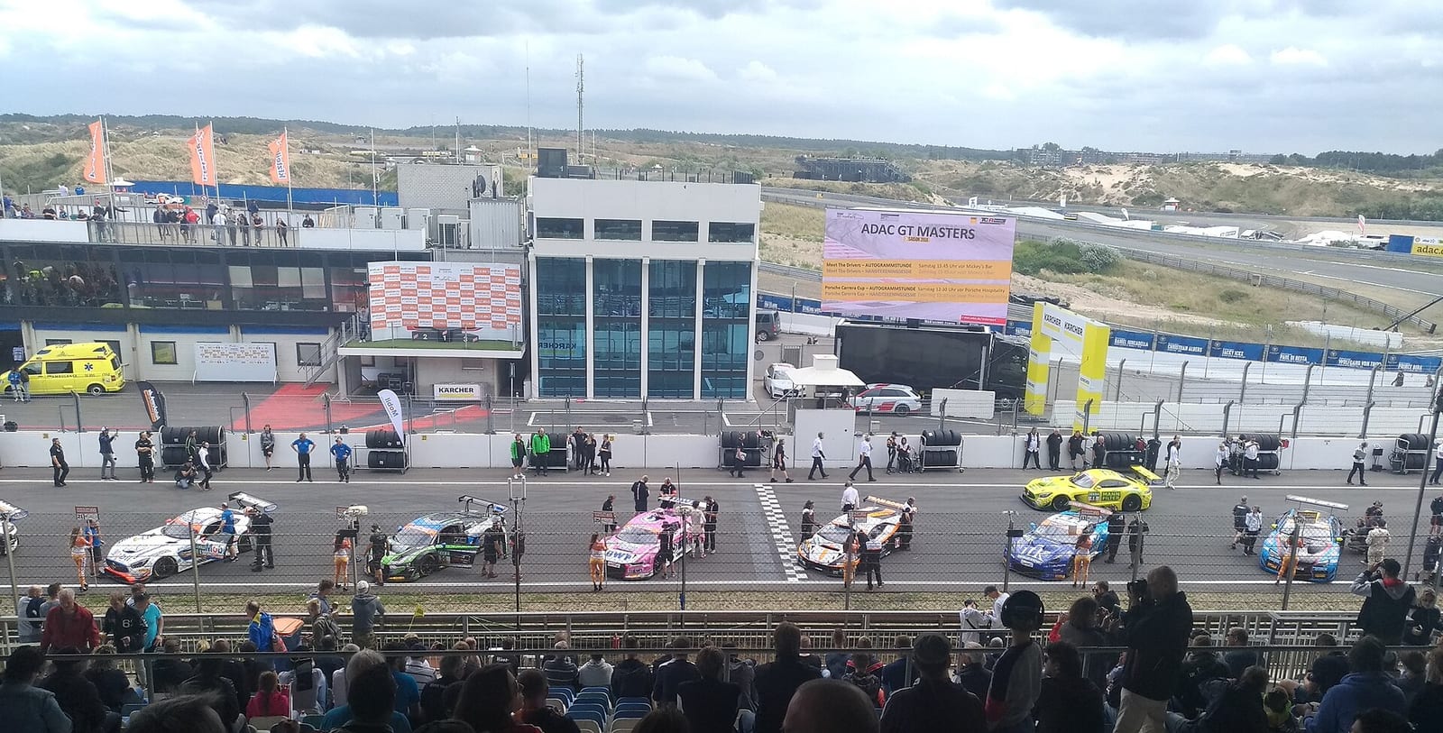 A grid of GT3 cars lined up before a race start