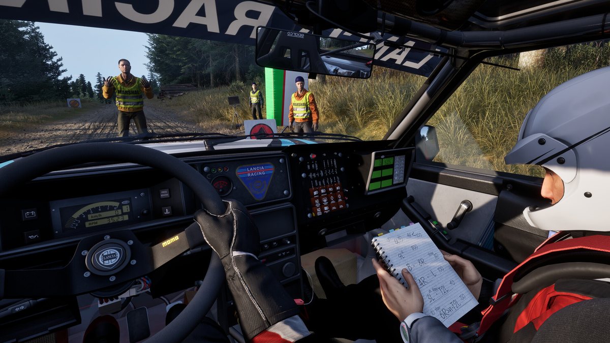 Cockpit view in Assetto Corsa Rally with the co-driver holding pace notes next to the driver
