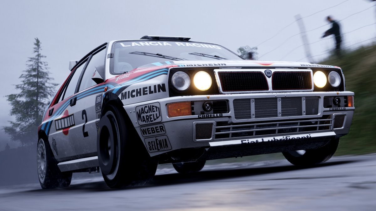 A Lancia Delta HF integrale in Martini colours on a wet road in Assetto Corsa Rally