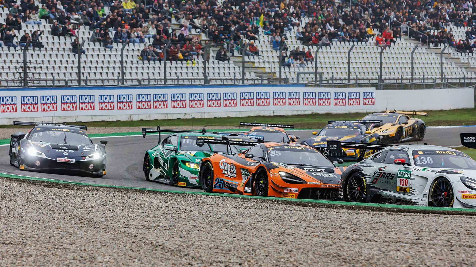 Pack of GT3 cars going through a corner at the 2024 DTM finale at the Hockenheimring