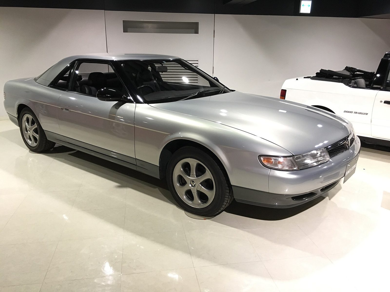 A silver Eunos Cosmo coupe in the Mazda Museum