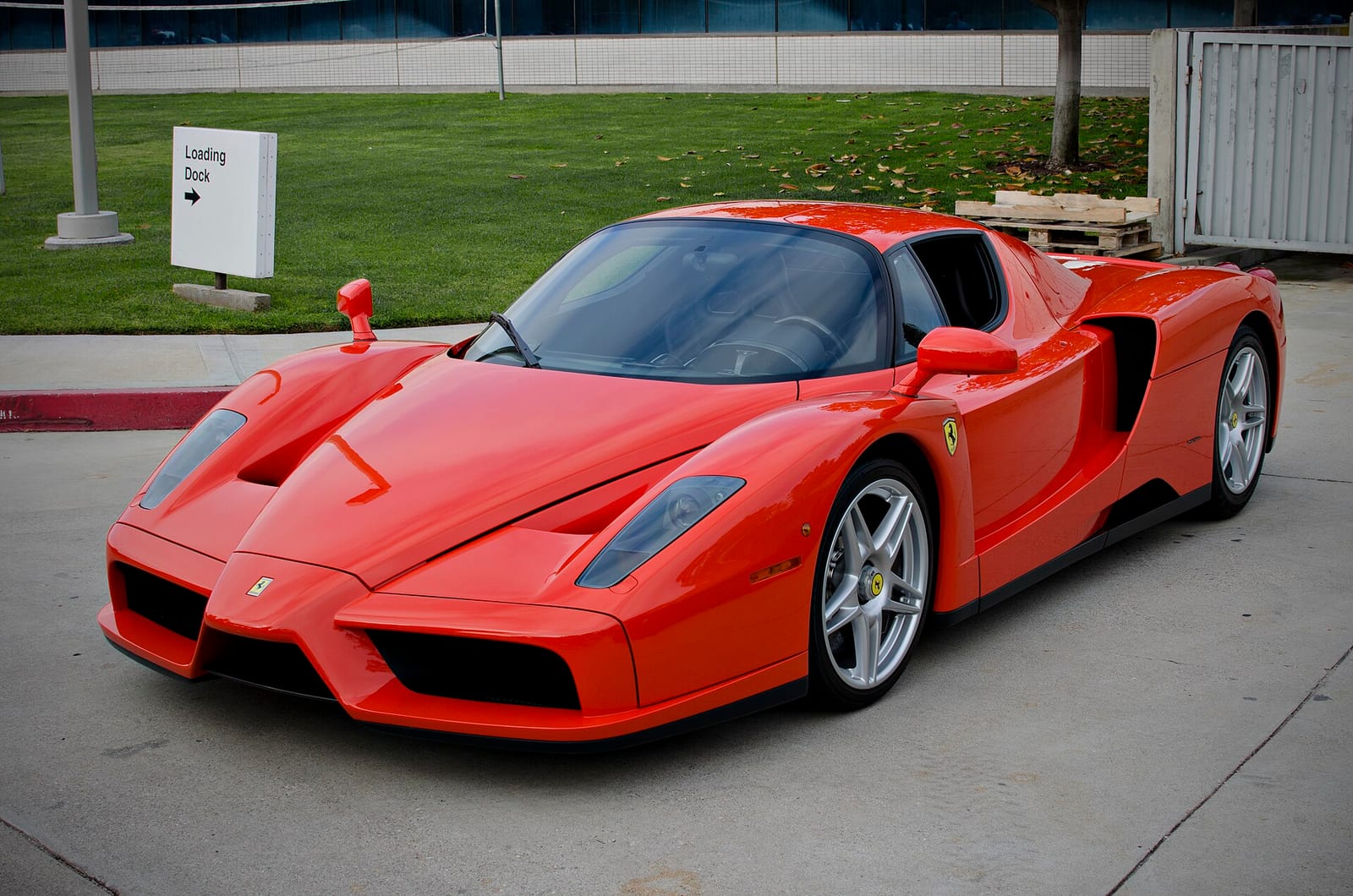 A red Ferrari Enzo parked outdoors