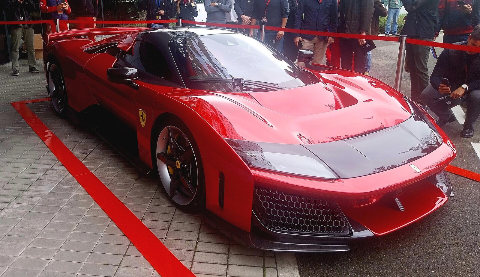 A red Ferrari F80 on display at the Ferrari factory in Maranello