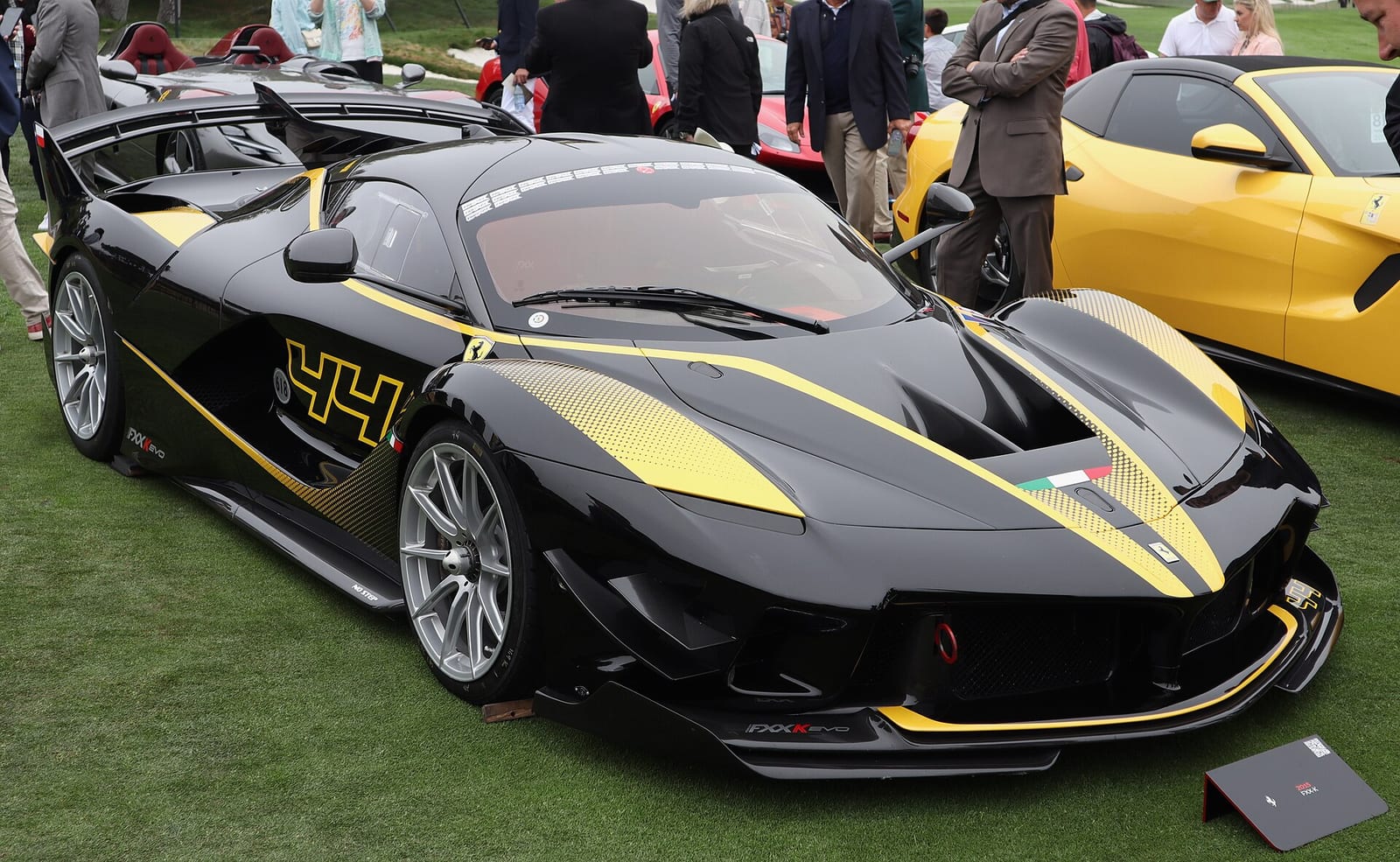 A black and gold Ferrari FXX K at the Casa Ferrari display in 2022