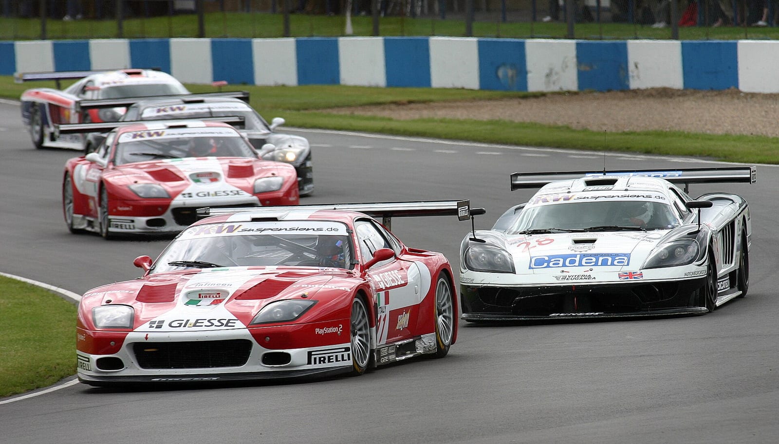 Ferrari and Saleen GT1 cars at Redgate corner in the 2004 FIA GT Championship round at Donington Park