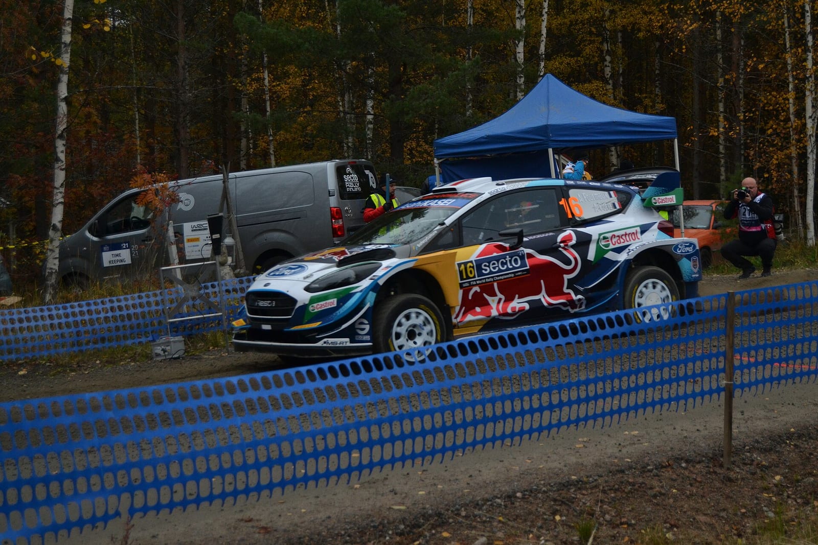 A Ford Fiesta WRC flat out through the trees at Rally Finland 2021