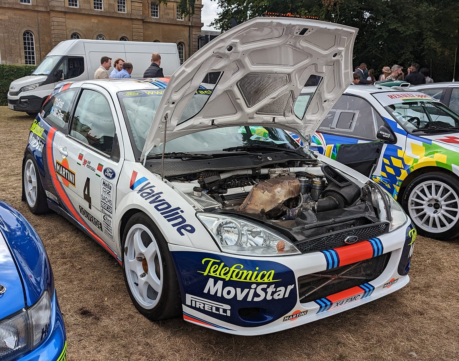 The 2001 Ford Focus RS WRC with the number 4 on the door and the bonnet open