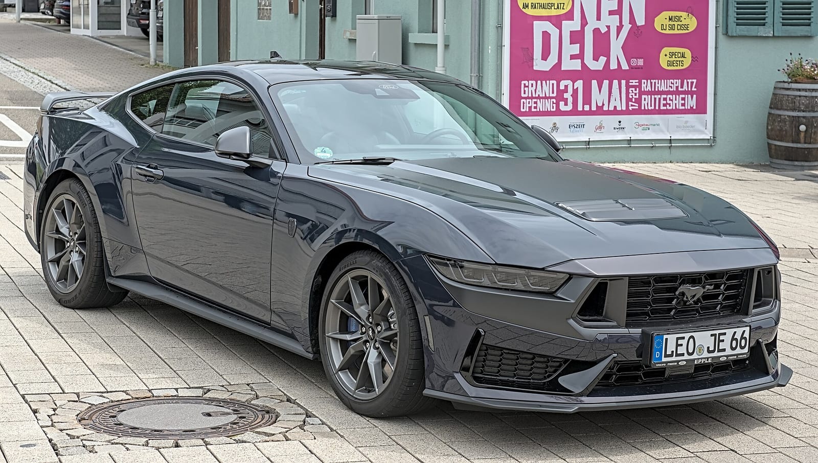 A dark blue Ford Mustang Dark Horse, front three quarter view