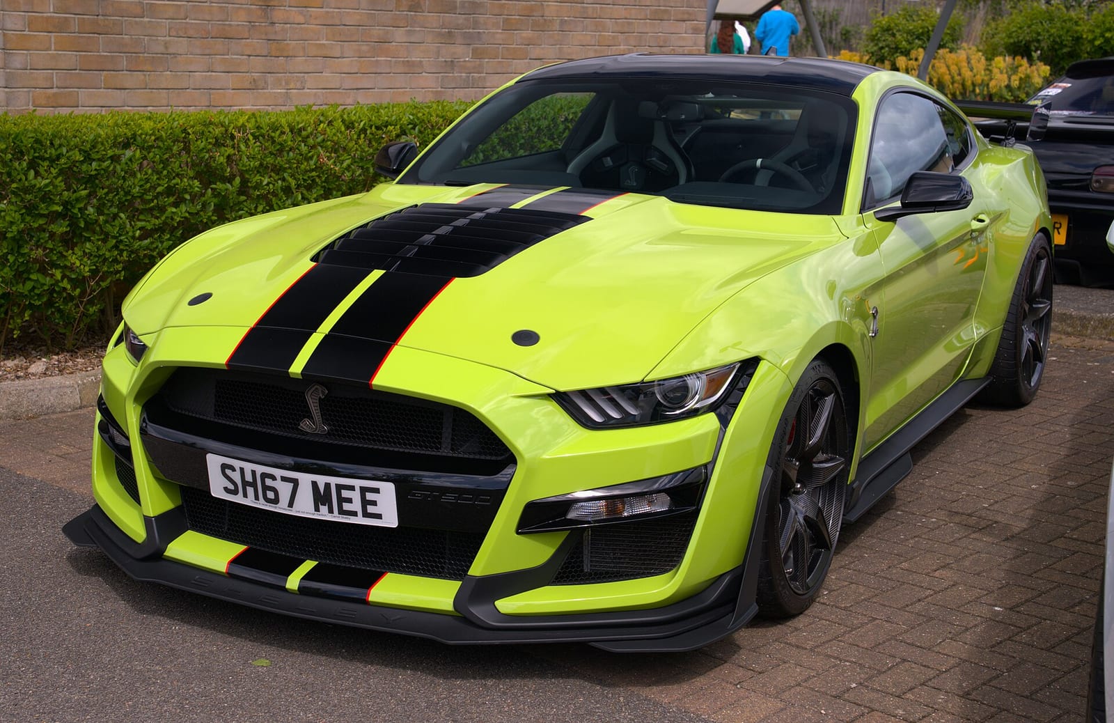 A green 2020 Ford Mustang Shelby GT500 with black stripes