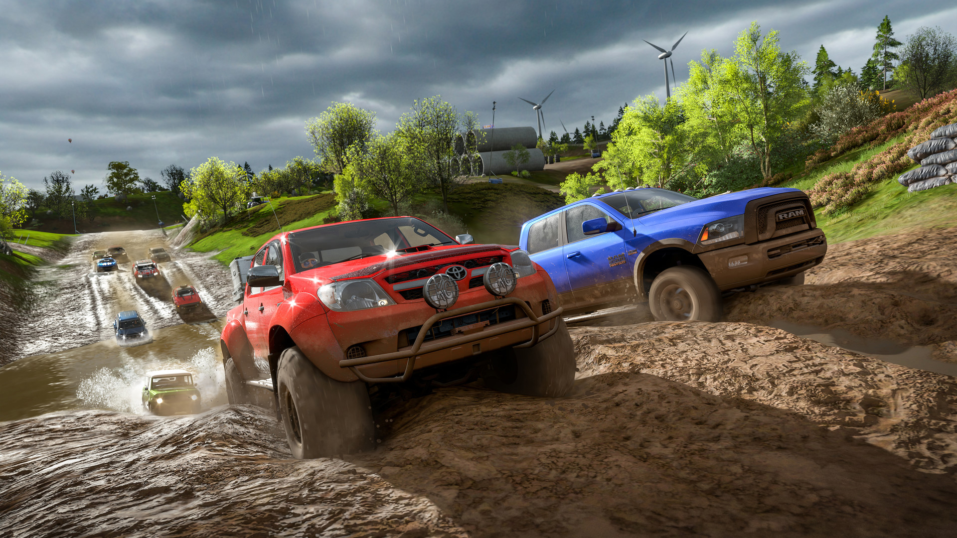 Two pickup trucks side by side on a muddy cross country track in Forza Horizon 4, with a pack of cars behind