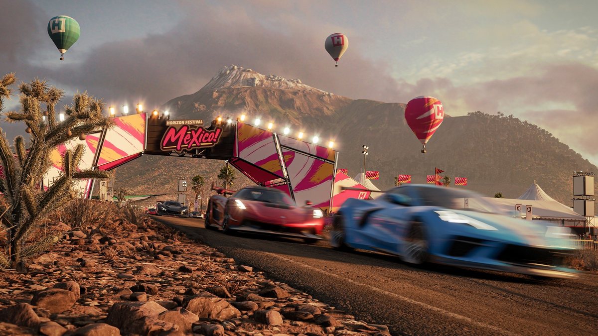 Two supercars cross the start line of a Horizon Festival race in Mexico in Forza Horizon 5