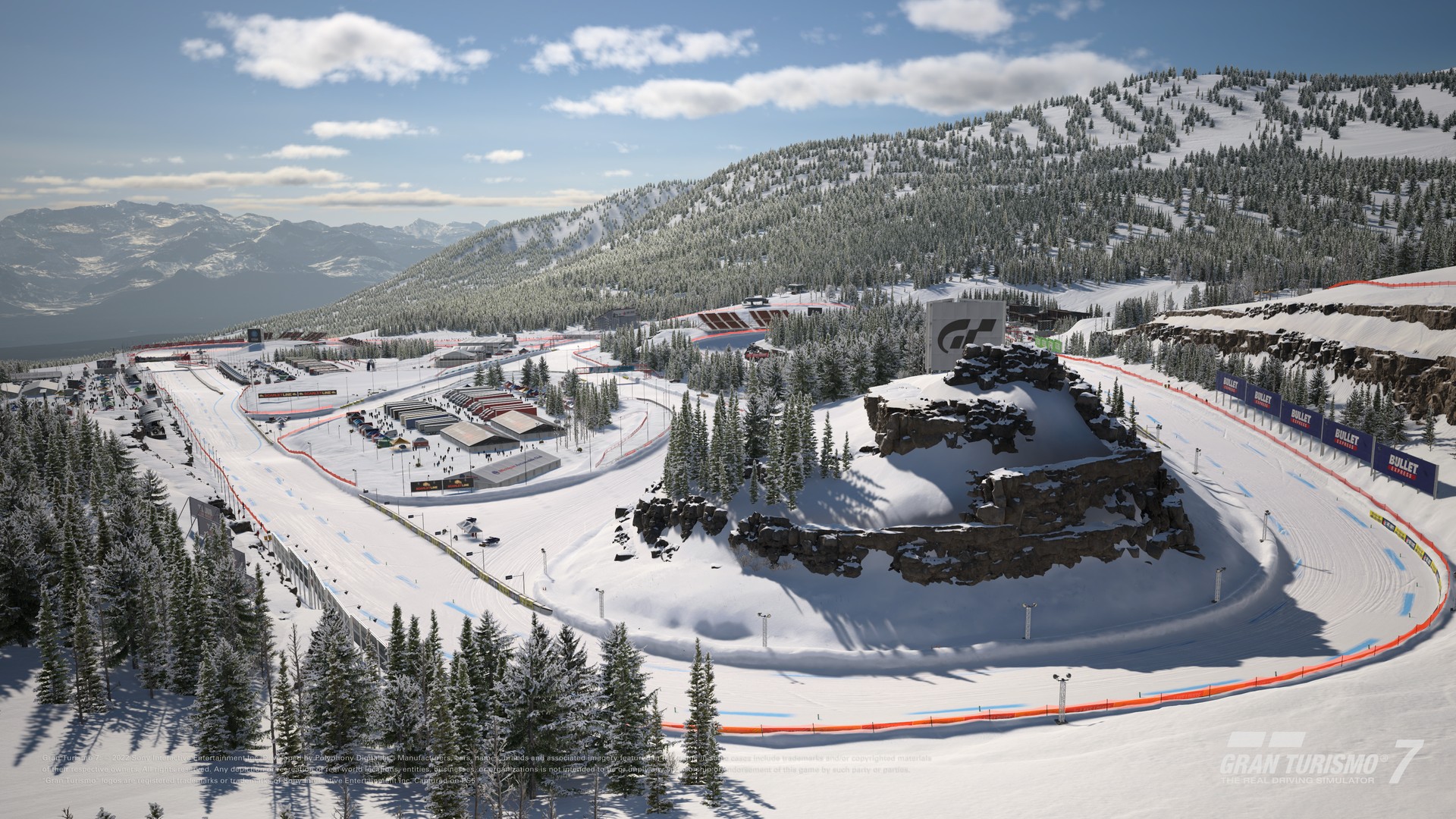 Aerial view of the Lake Louise snow circuit in Gran Turismo 7 with the Canadian Rockies behind