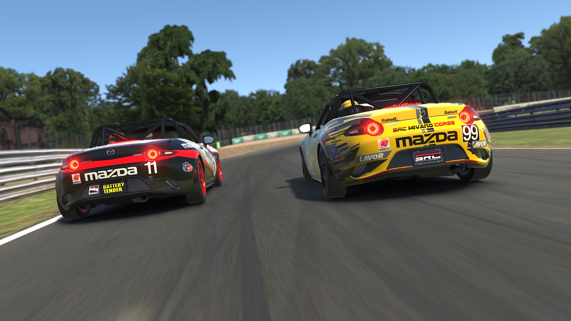 Two Mazda MX-5 Cup cars racing side by side through a corner in iRacing, the red number 11 ahead of the yellow car