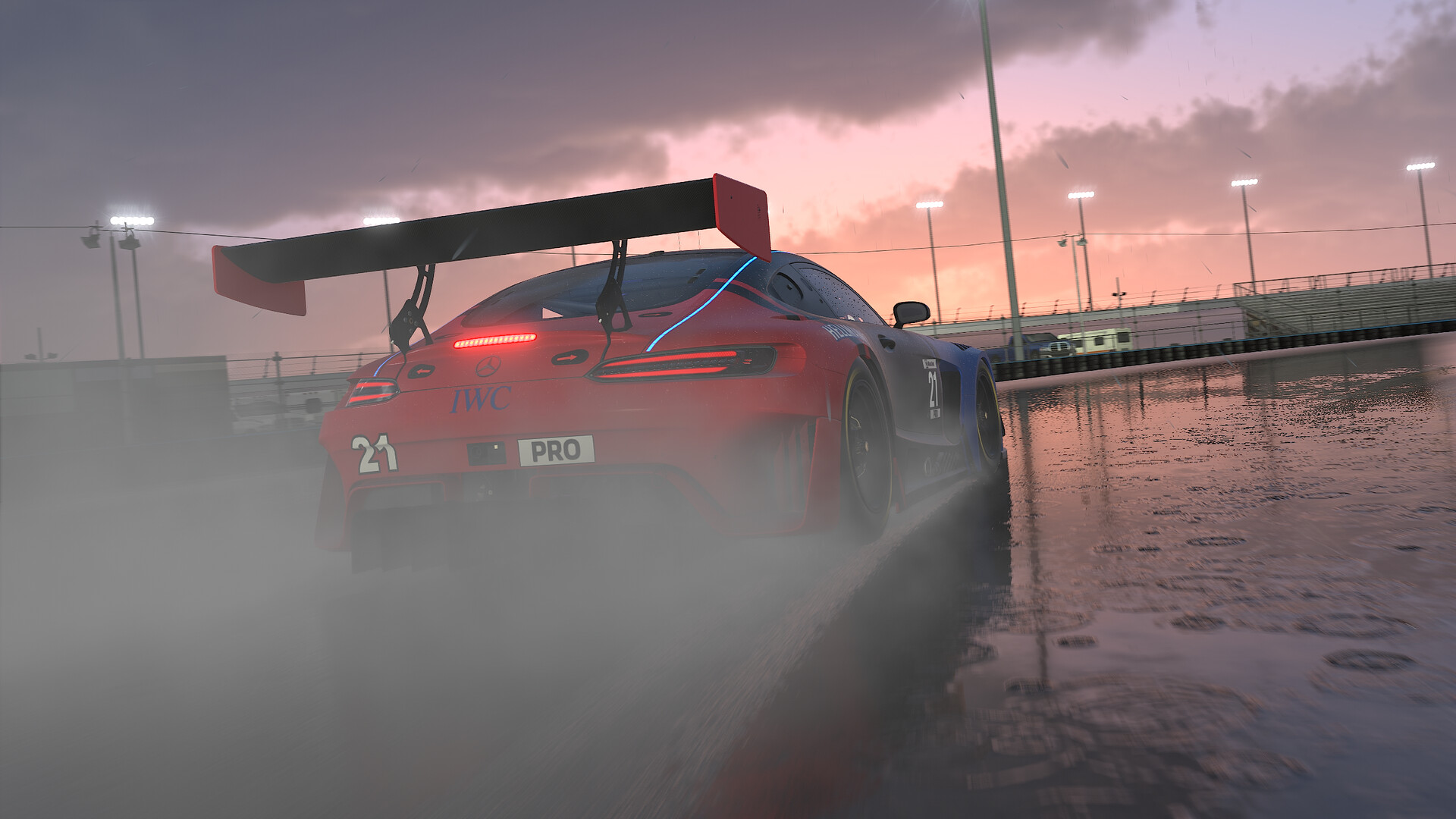 A red Mercedes-AMG GT3, seen from behind, throws up spray on a soaked track at dusk in iRacing