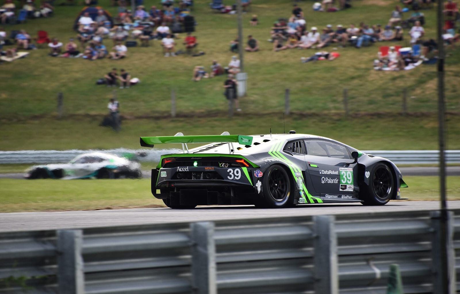 A Lamborghini Huracan GT3 Evo seen from the side on track