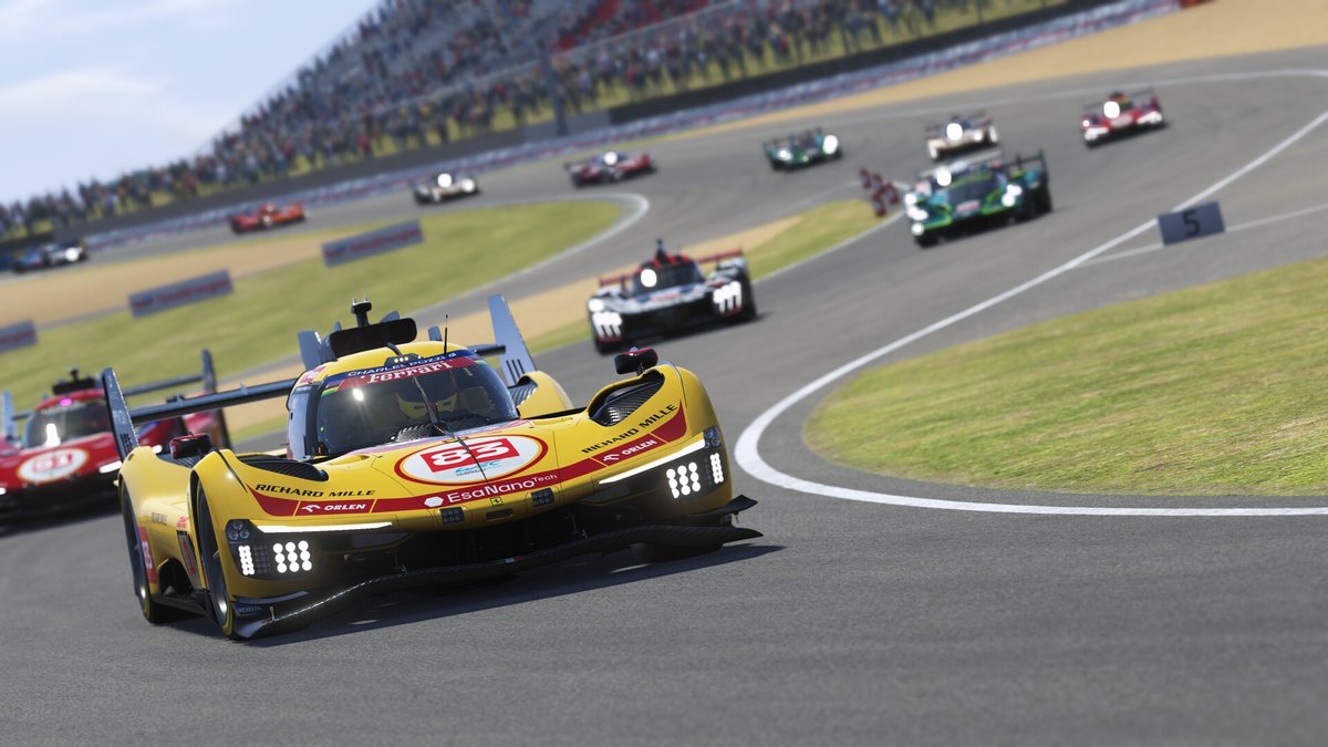 A Ferrari 499P in yellow leads a pack of prototypes in Le Mans Ultimate