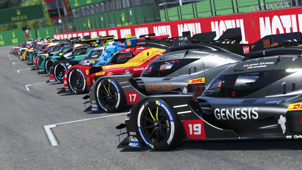 A grid of Hypercars lined up on the start straight in Le Mans Ultimate