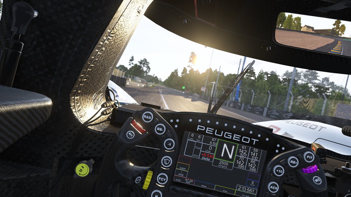 Cockpit view from a Peugeot prototype in Le Mans Ultimate, with the steering wheel display in front of the driver