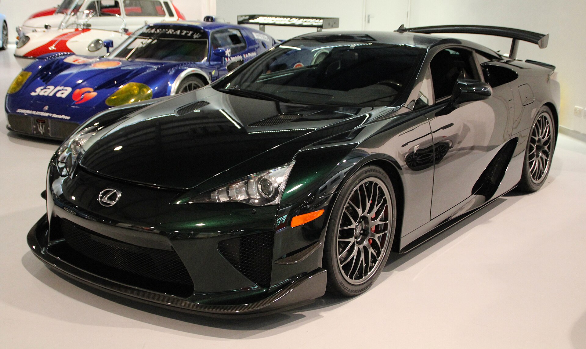 A green Lexus LFA Nurburgring Edition at a car show