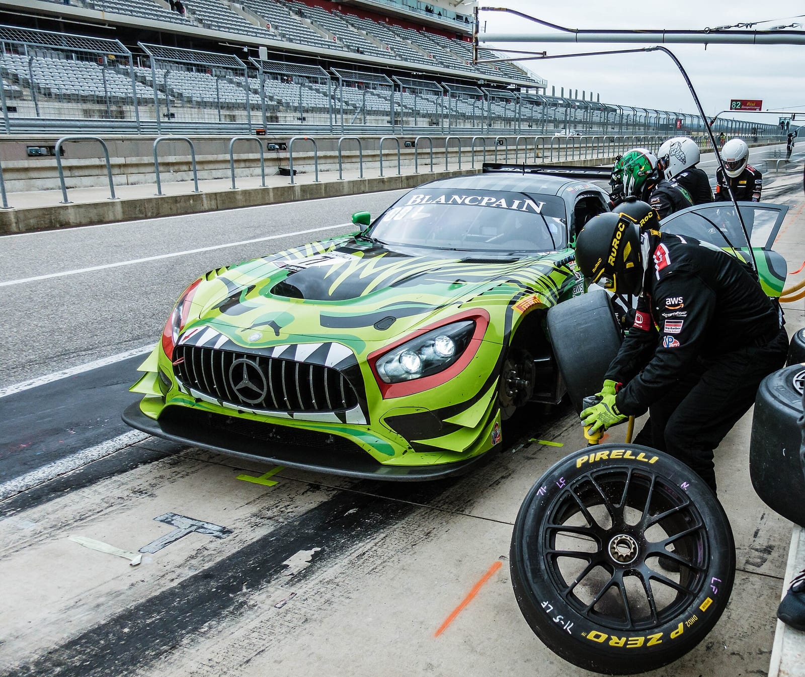 A Mercedes AMG GT3 in the pit lane during a tyre change at Circuit of the Americas