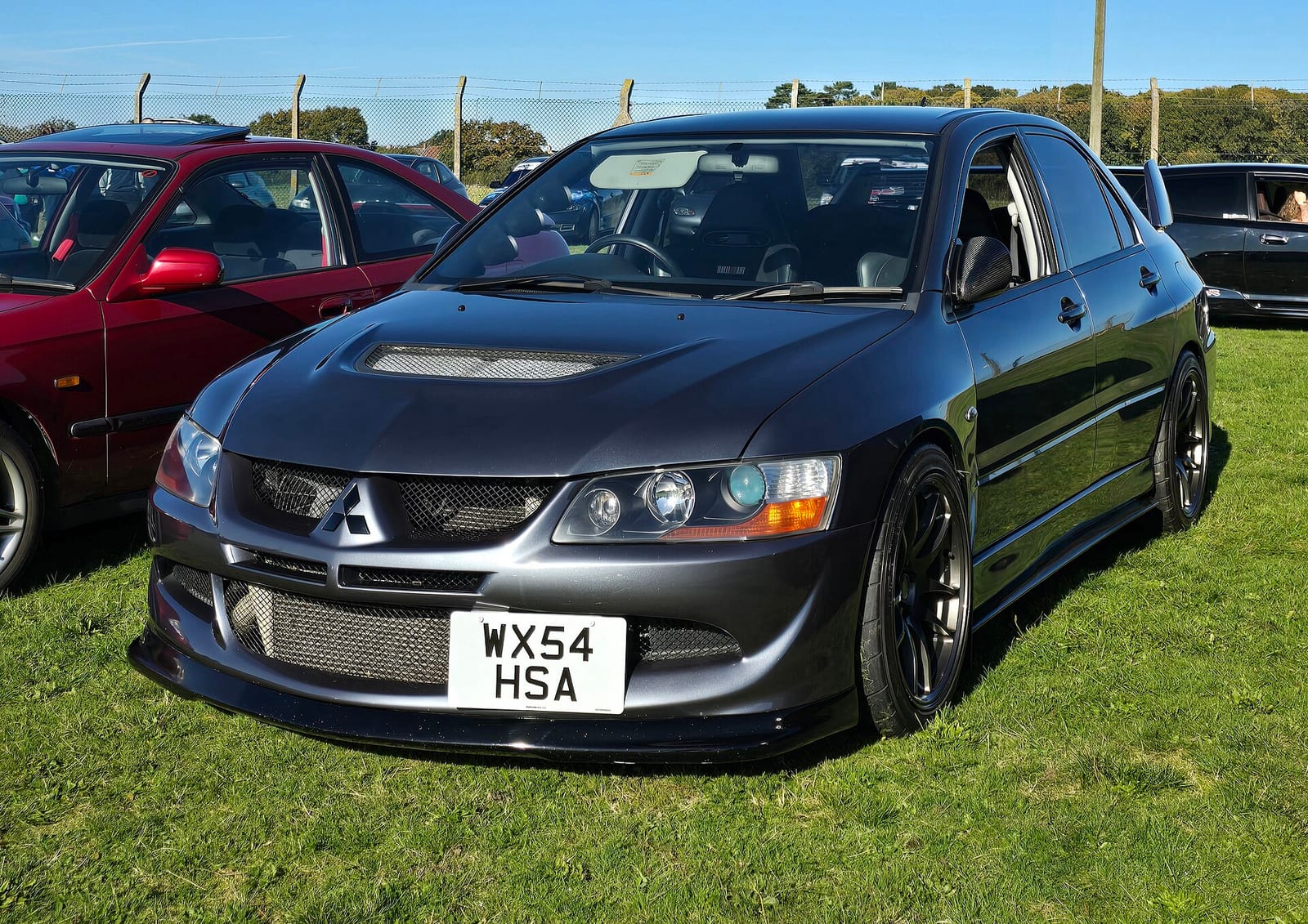 A grey 2004 Mitsubishi Lancer Evolution VIII MR, front three quarter view