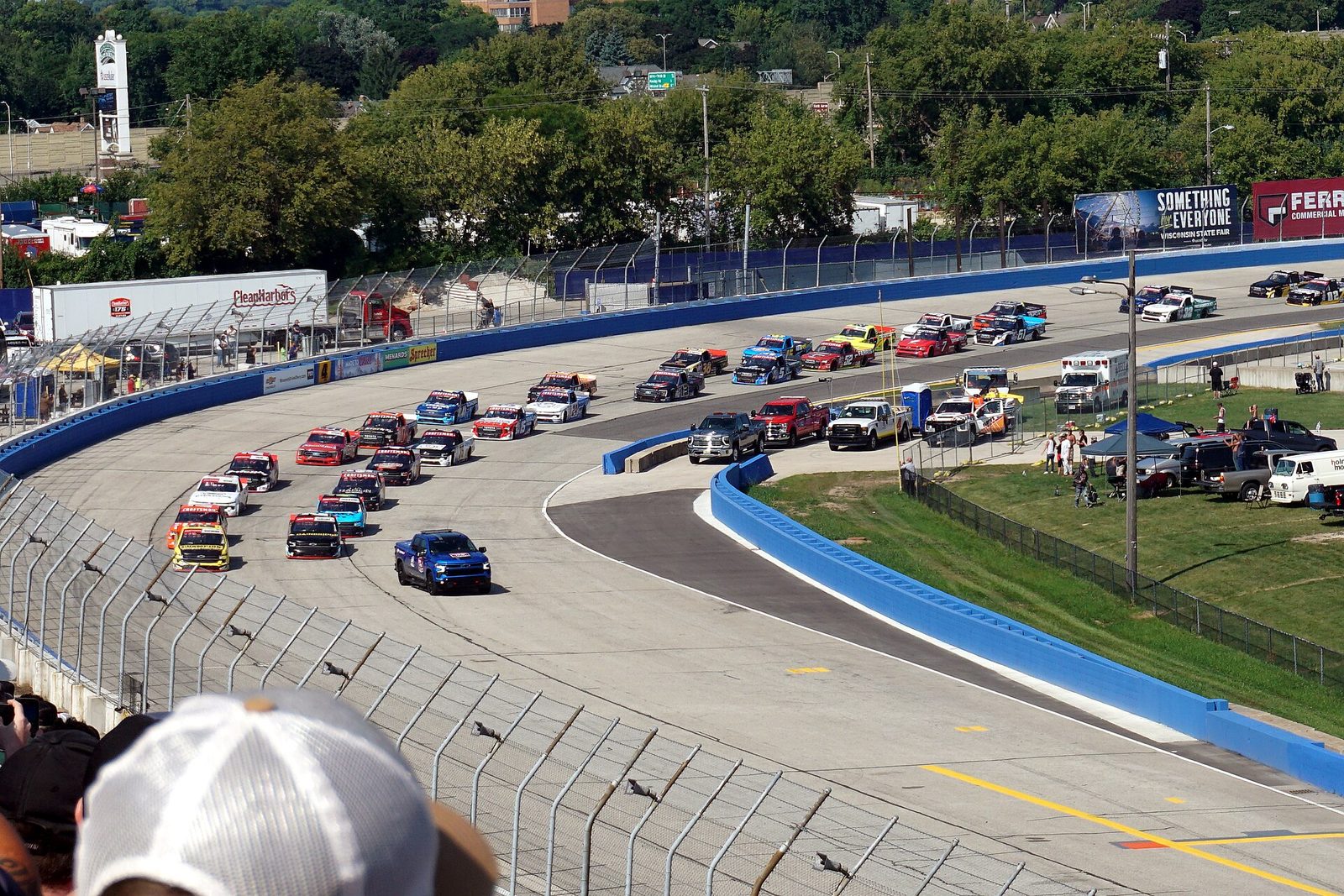 The start of a NASCAR Craftsman Truck Series race at the Milwaukee Mile with the pack in turn one