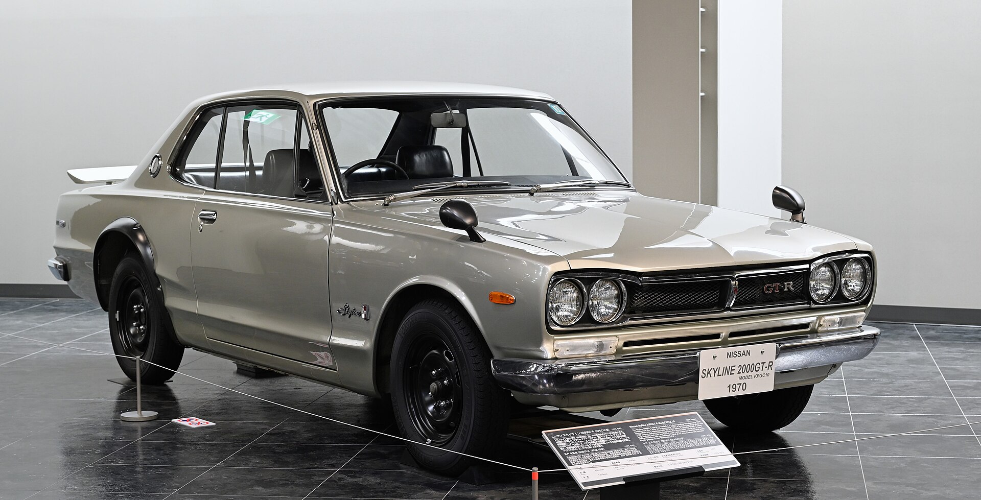 A silver 1970 Nissan Skyline 2000GT-R in a showroom