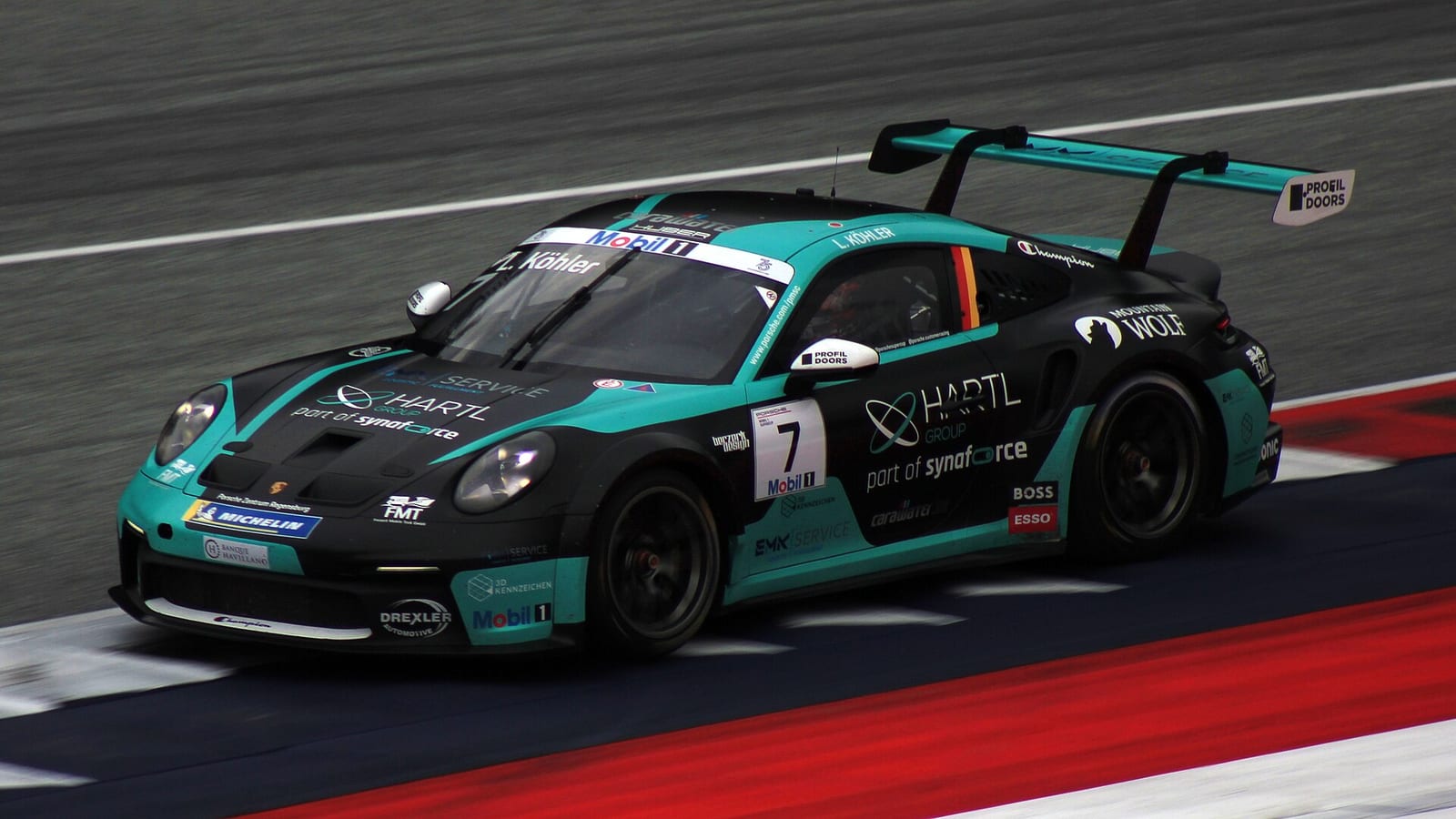 A Porsche 911 GT3 Cup car racing in the Porsche Supercup