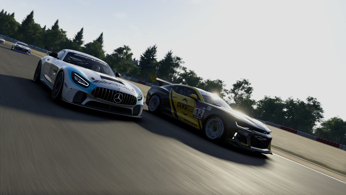 Two GT4 cars side by side at speed in Project Motor Racing