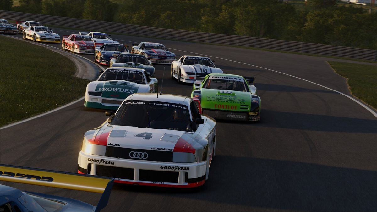 An Audi 90 IMSA GTO leads a pack of Camaro, Mazda RX-7 and Mercury Cougar GTO cars in Project Motor Racing