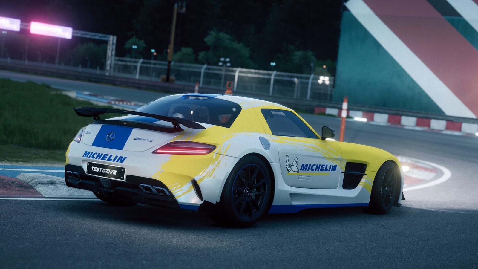 A Mercedes-Benz SLS AMG in a white and yellow Michelin livery on a circuit at night in Test Drive Unlimited Solar Crown