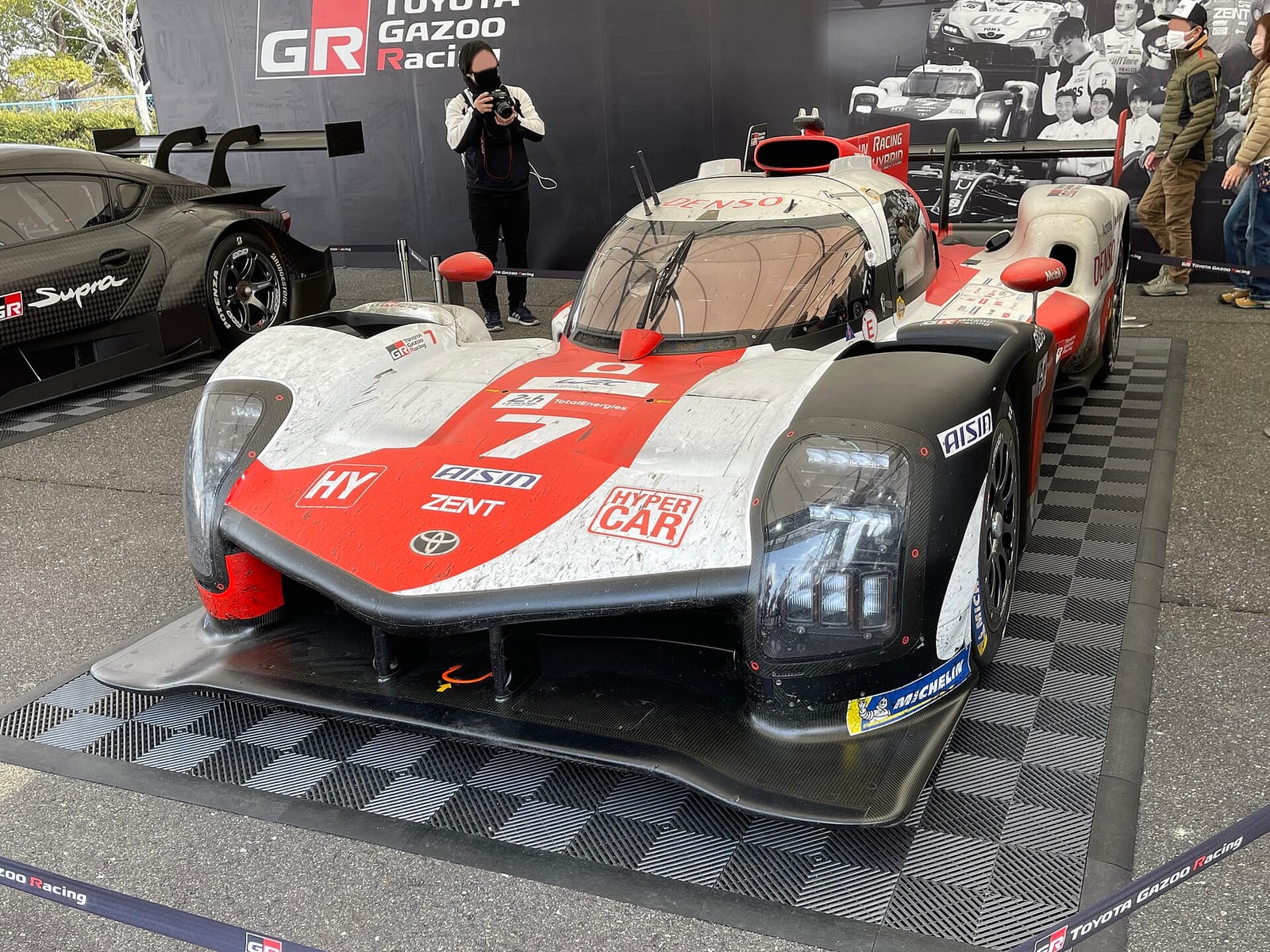 The number 7 Toyota GR010 Hybrid in its 2021 World Endurance Championship livery on display at Suzuka