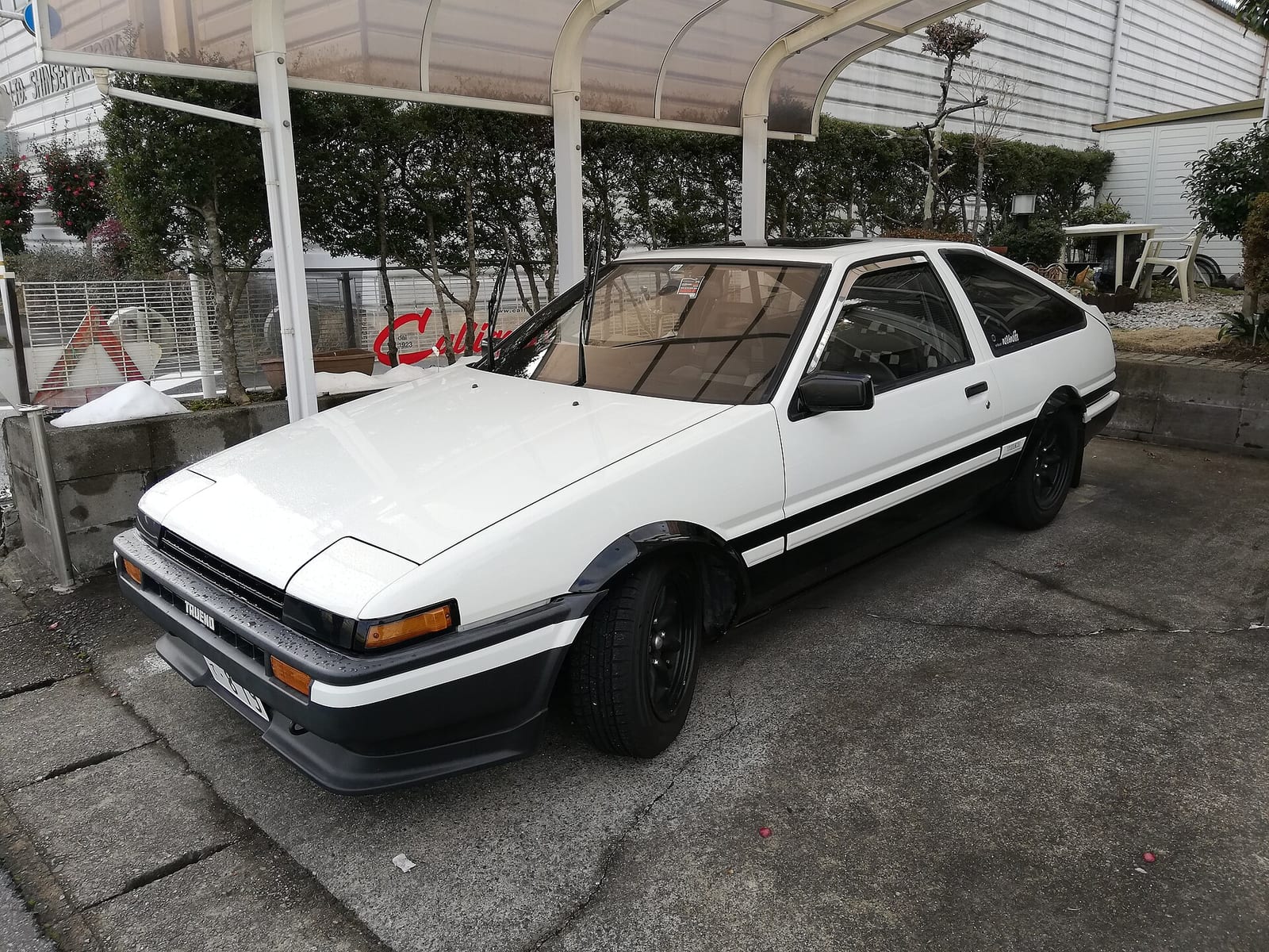 A white and black Toyota Sprinter Trueno GT Apex (AE86)