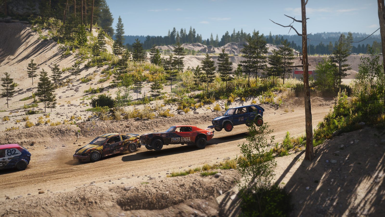 A pack of cars racing on gravel in Wreckfest 2