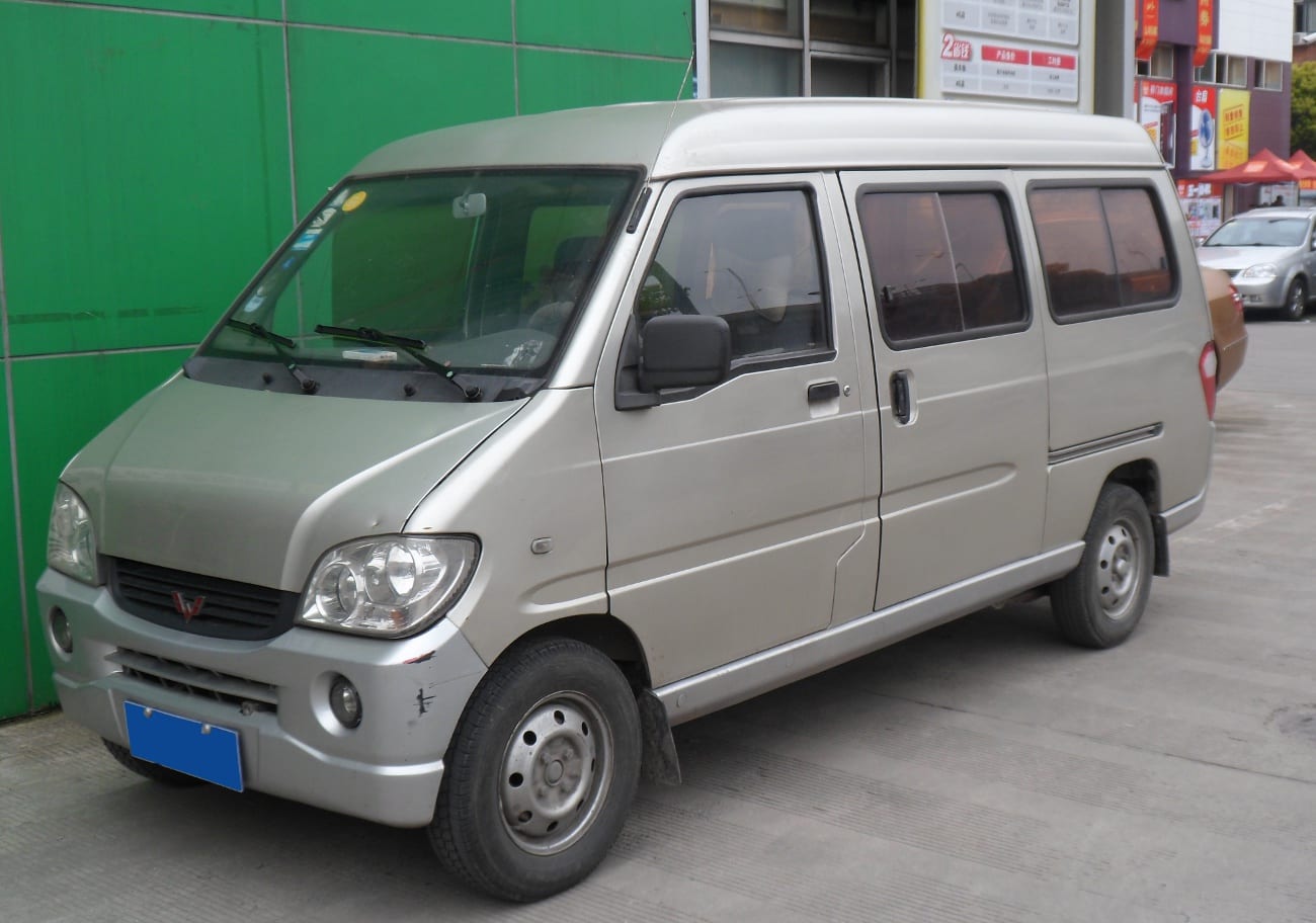 A silver Wuling Sunshine minivan parked on a street in China