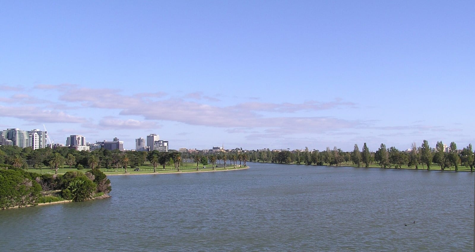 Albert Park Lake in Melbourne with the city skyline behind it