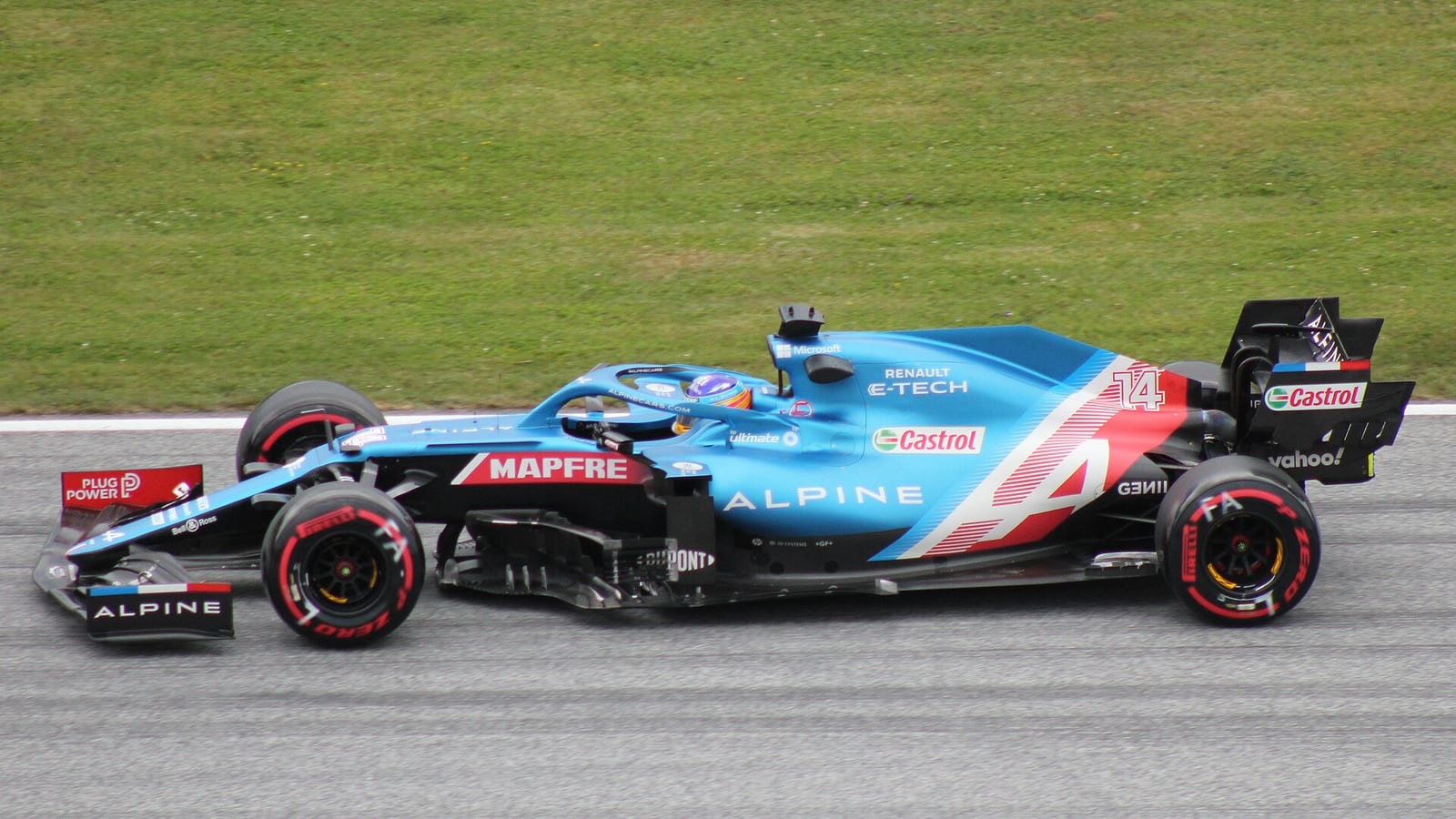 Fernando Alonso in the Alpine A521 seen from the side at the Red Bull Ring in 2021