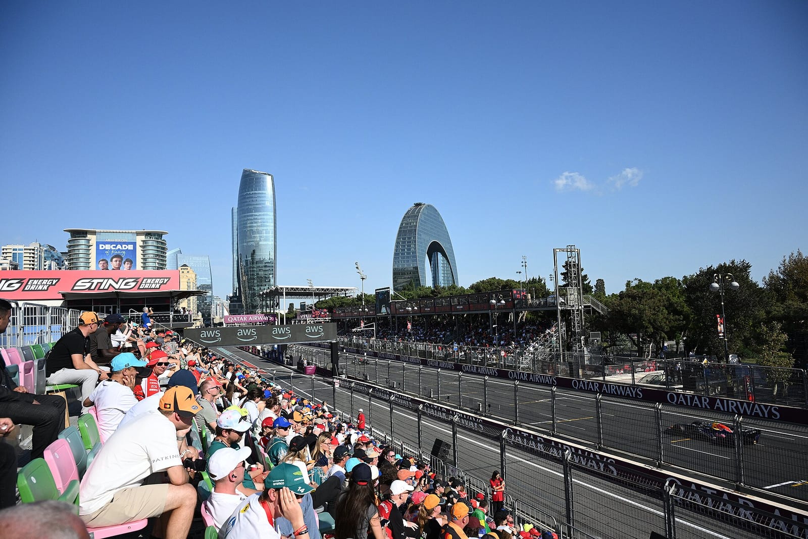 A full grandstand at the Baku City Circuit in 2026 with the track below and the city skyline behind