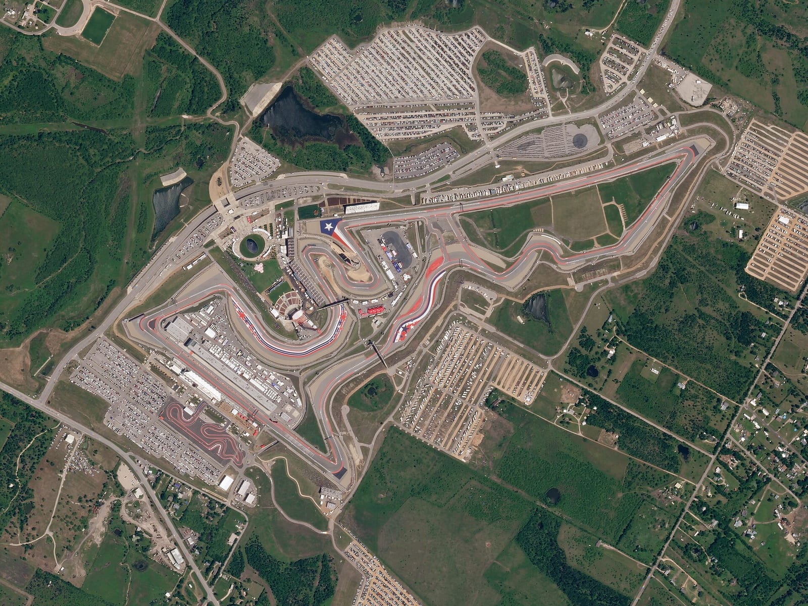 Satellite view of Circuit of the Americas in Austin, Texas, with the full layout and the car parks around it