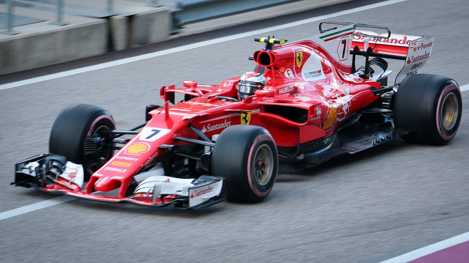 Kimi Raikkonen's red Ferrari SF70H, number 7, seen from the front at speed in Austin during the 2017 United States Grand Prix weekend