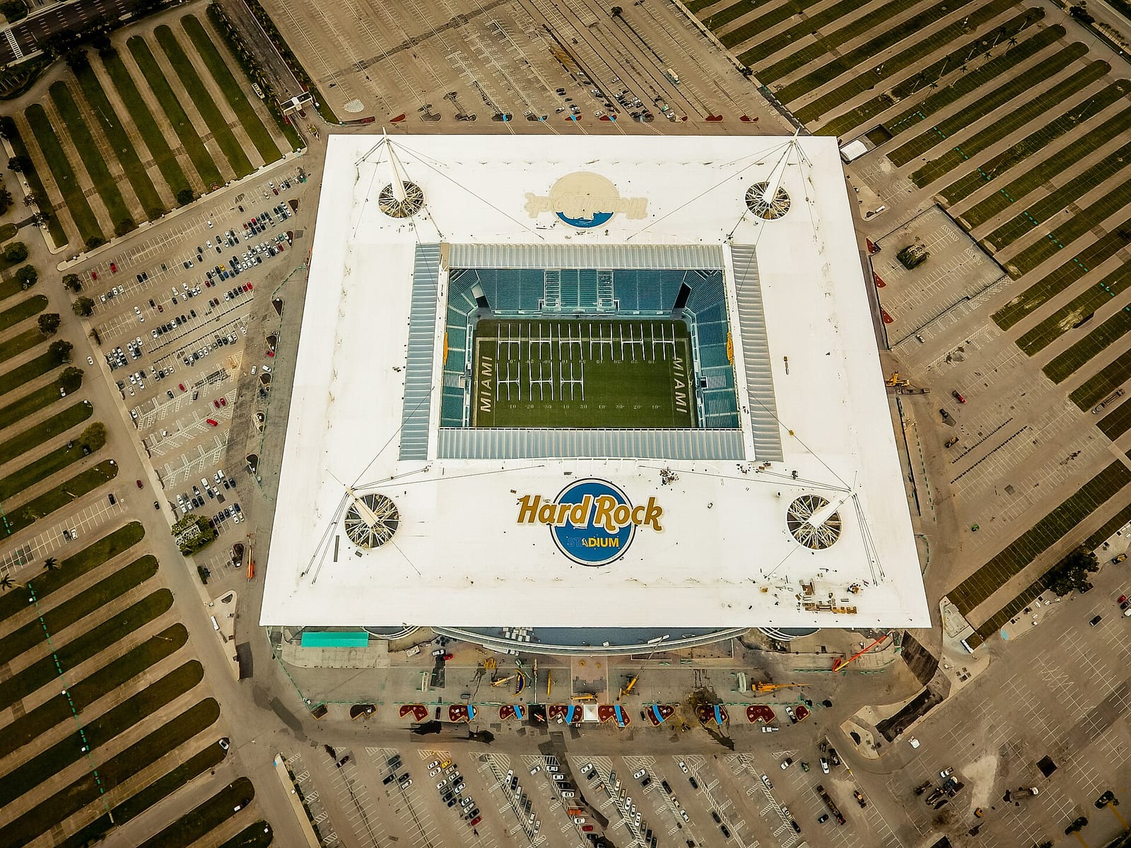 Hard Rock Stadium in Miami Gardens seen from directly above, surrounded by its car parks