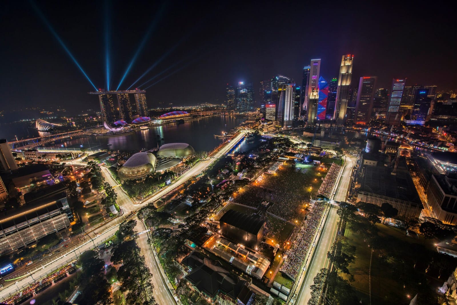 The Marina Bay Street Circuit lit up at night during the 2012 race weekend, seen from above with the Singapore skyline behind it