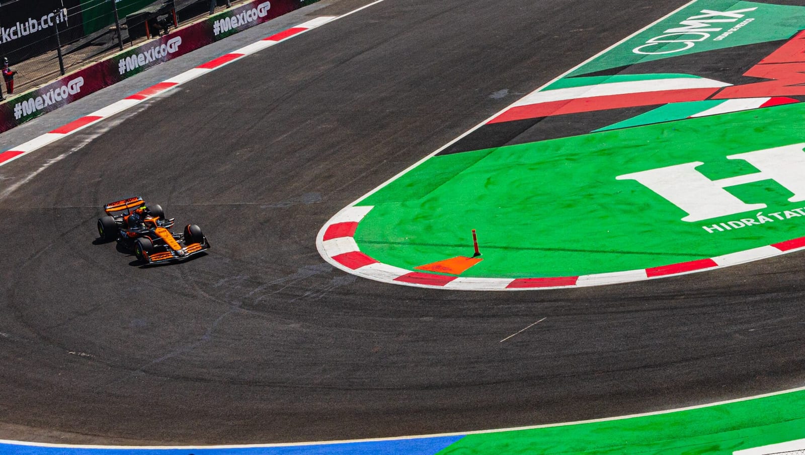 Oscar Piastri's papaya McLaren MCL38 turning through a corner at the Autodromo Hermanos Rodriguez during the 2024 Mexico City Grand Prix weekend