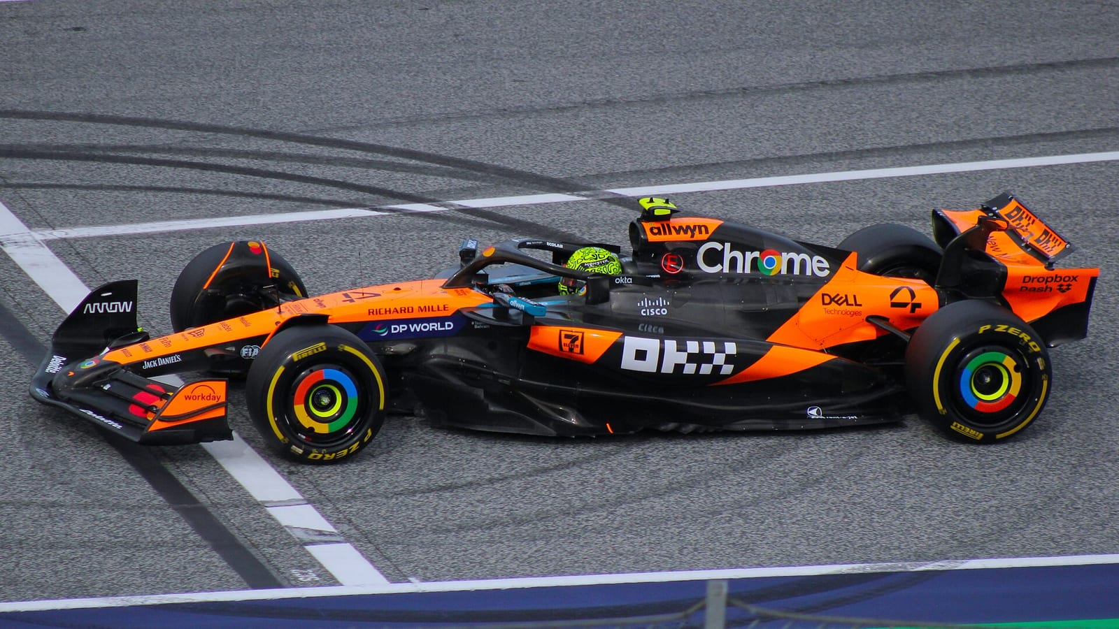 A papaya and black McLaren MCL39 with the number 4 on track at the Red Bull Ring during the 2025 Austrian Grand Prix weekend