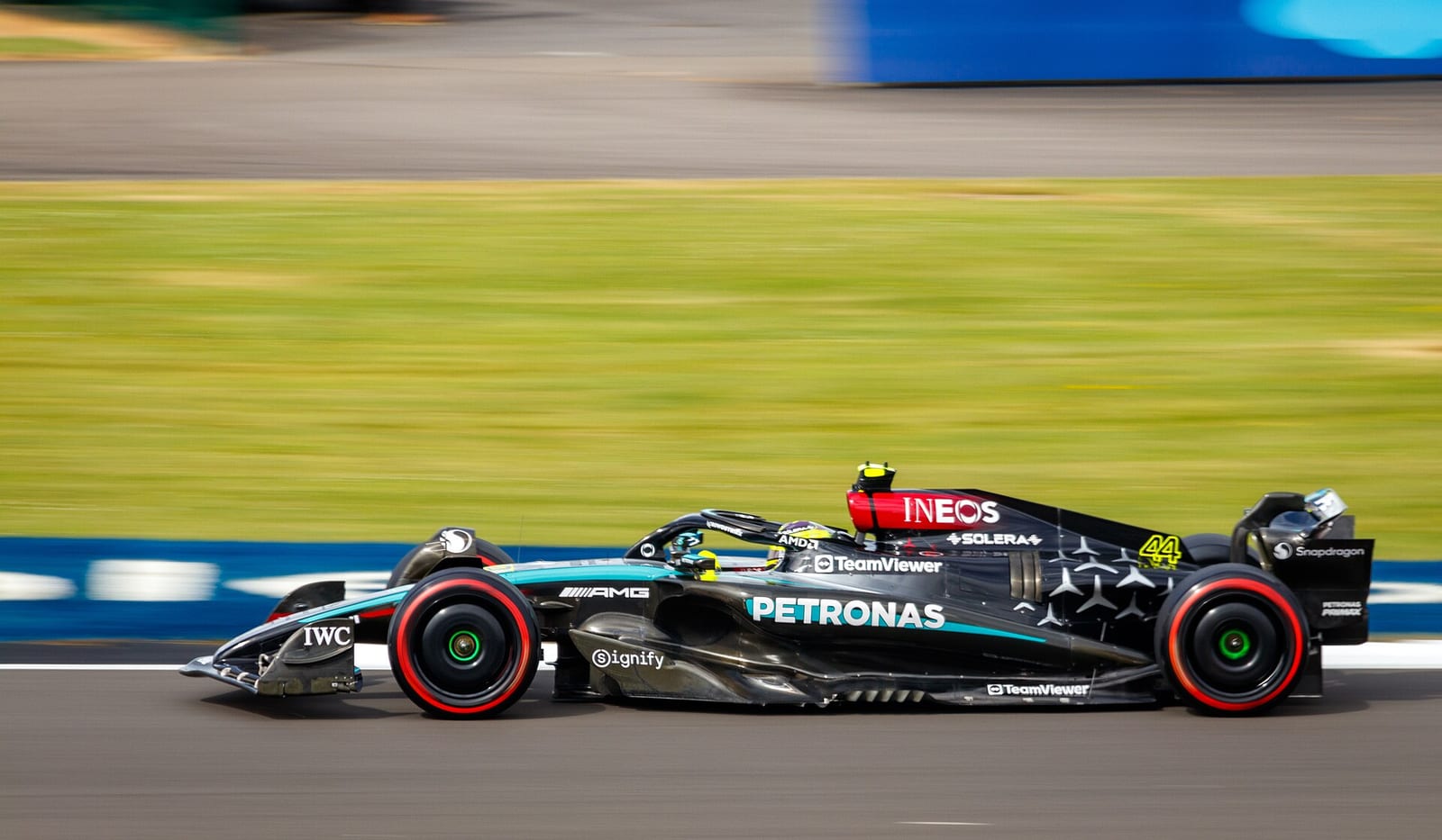 Lewis Hamilton in the black and silver Mercedes W15 on soft tyres at Silverstone during the 2024 British Grand Prix weekend
