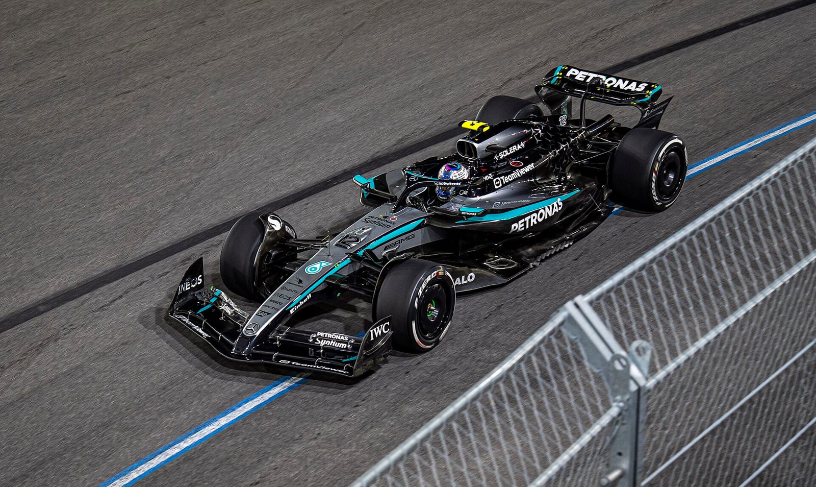 A silver and black Mercedes W16 seen from above on track at the 2025 Las Vegas Grand Prix