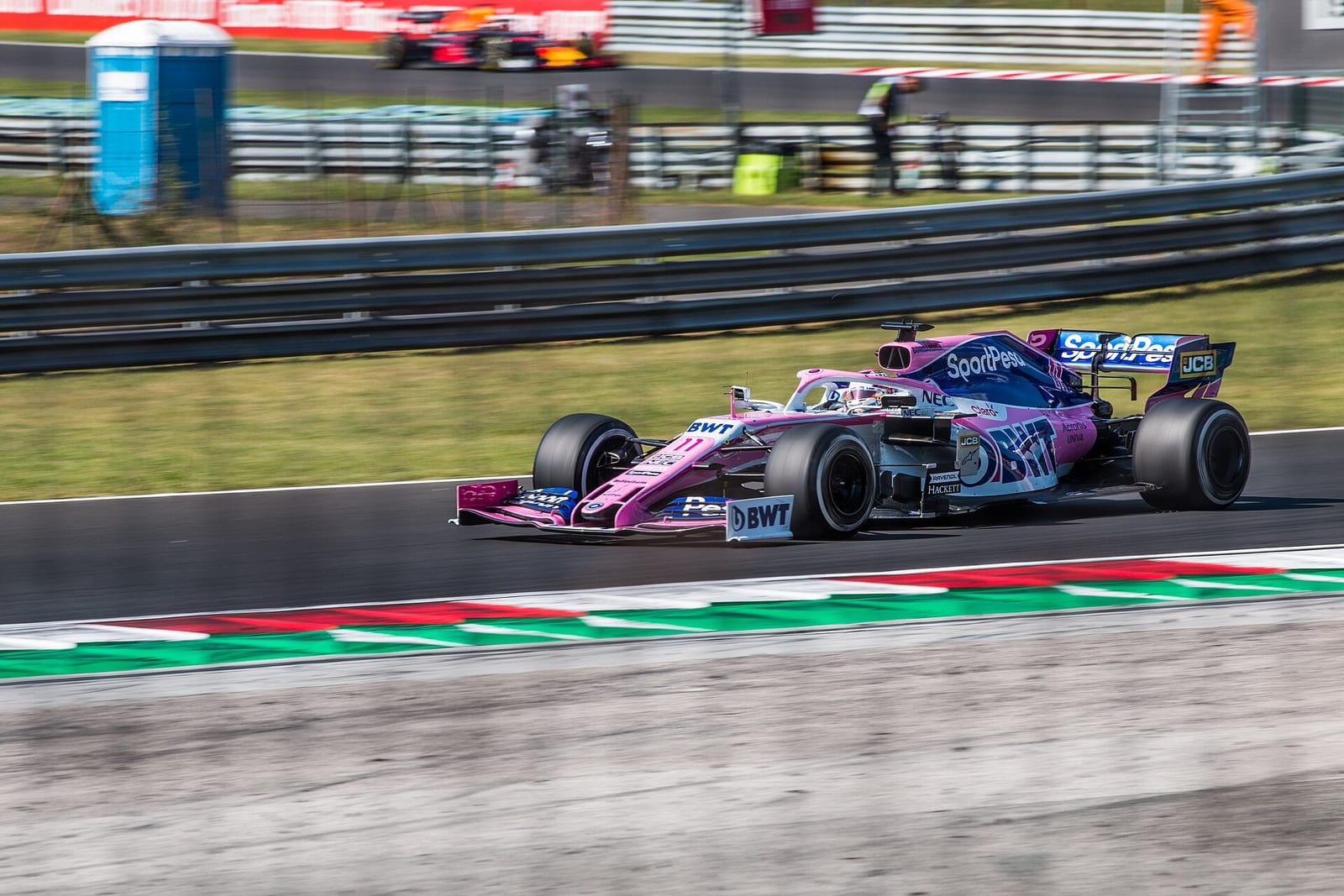 Sergio Perez's pink Racing Point RP19 side on at the Hungaroring during the 2019 Hungarian Grand Prix weekend
