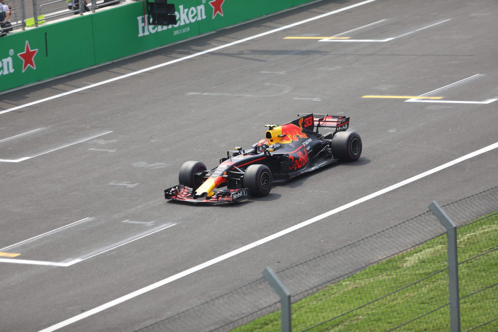 Max Verstappen in the Red Bull RB13 on the main straight at the 2017 Mexican Grand Prix